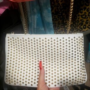 One Christian Louboutin hand clutch